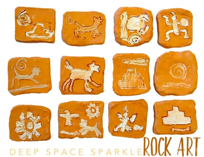 Clay tiles with cave-painting inspired designs