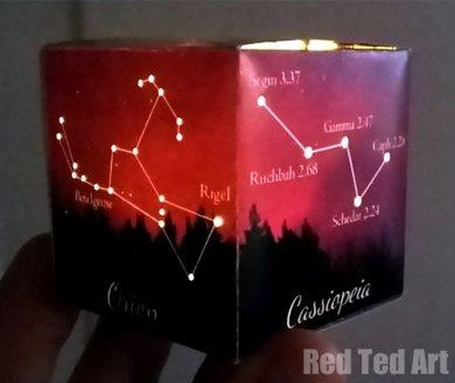 Space Activities for Kids teach about constellations like this paper cube with a different constellation printed on each face with holes poked through to allow light from a candle in the center to shine through