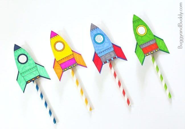 space activities for kids include crafts like these 4 colorful paper rockets attached to striped drinking straws