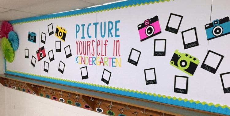 Bulletin board with paper cameras and space for student pictures (Back-to-School Bulletin Board Ideas)