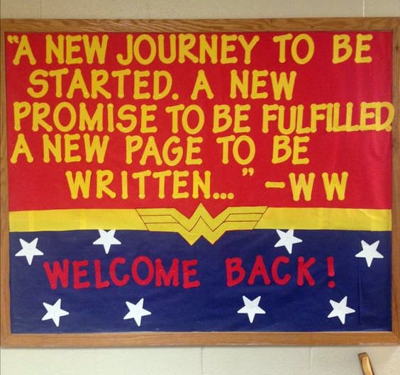 Wonder Woman themed bulletin board reading "A new journey to be started. A new promise to be fulfilled. A new page to be written."