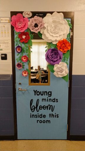 young minds bloom inside this room. classroom door decoration with giant flowers