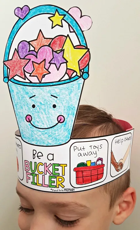 a child wearing a colorful bucket filler headband as an example of bucket filler activities