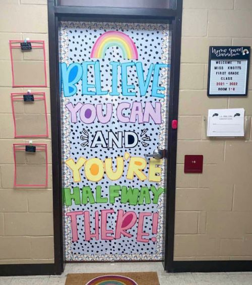 Classroom door with colorful lettering reading Believe You Can and You're Halfway There
