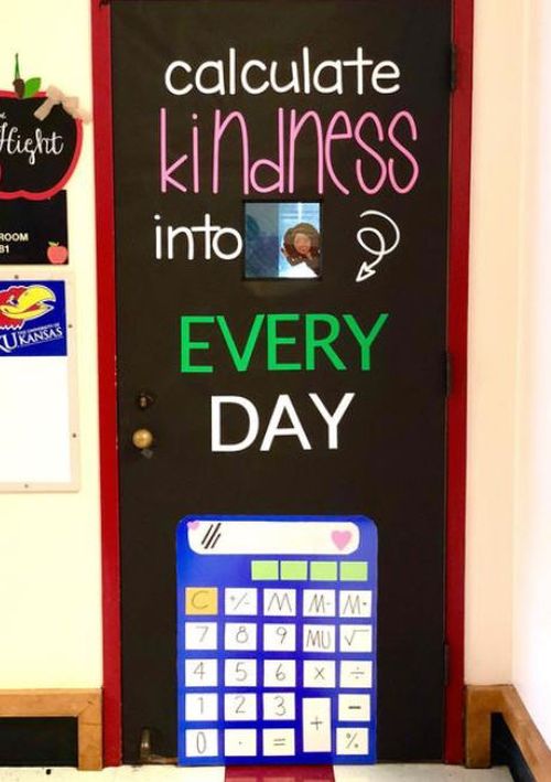 Door decorated with a large paper calculator. Text reads Calculate kindness into every day.