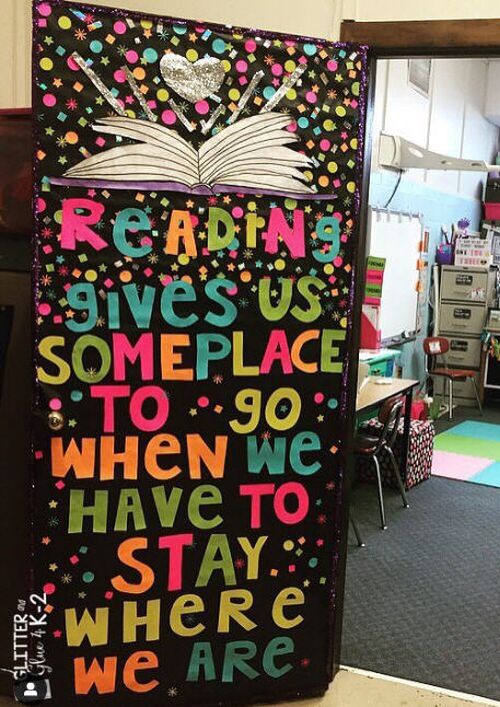 Classroom door with book design. Text reads Reading gives us someplace to go when we have to stay here.