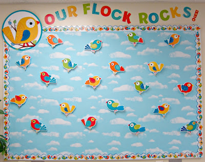 Our flock rocks birds and a blue sky clouds background back to school bulletin board