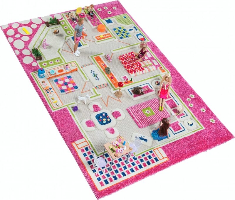 A pink rug is divided into rooms of a house with furniture printed on it in this example of classroom rugs.