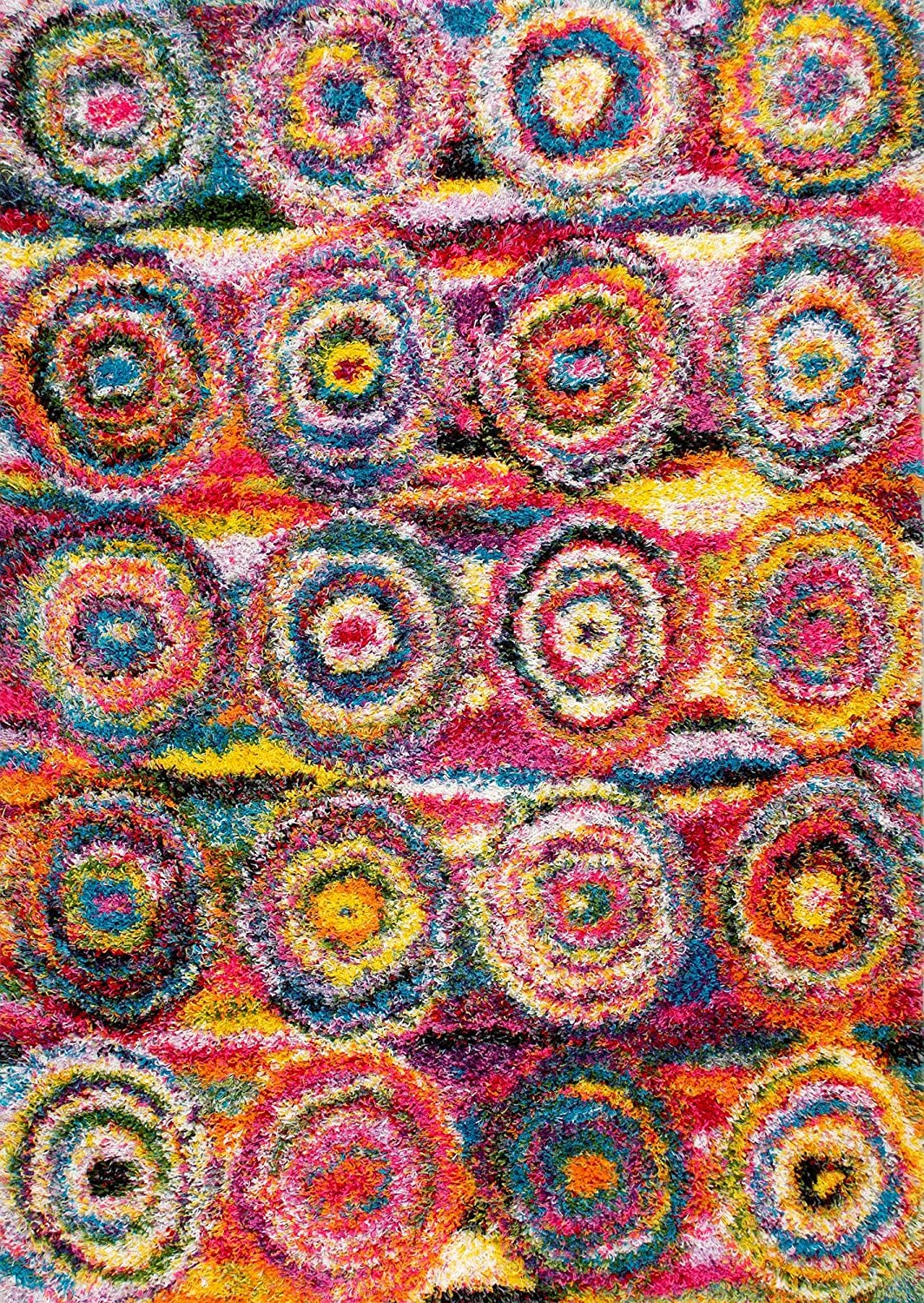 A shaggy rainbow rug with circles is shown as an example of  classroom rugs.