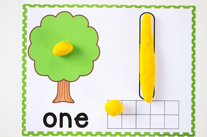 mat with number one, one tree, and ten frame with one pom pom for a preschool activity
