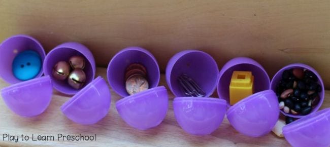 Purple plastic eggs filled with a variety of small items