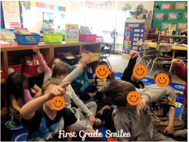 Students using their fingers to write letters in the air (Decoding Strategies)