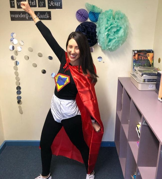 Woman in a black bodysuit with large pair of underpants, red cape, and Captain Underpants logo (Book Character Costume Ideas)