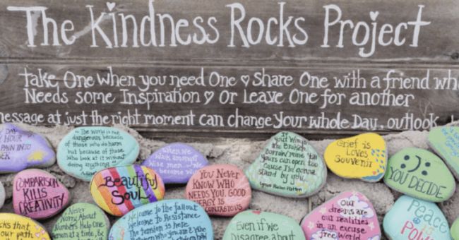 Pile of painted rocks with inspiring messages