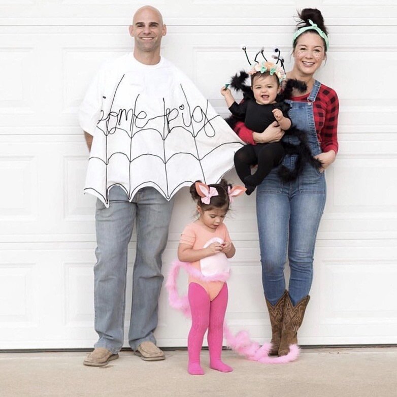 A family is shown dressed as a spider web, pig, spider, and a woman in overalls and a flannel.- book character costume
