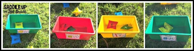 Colored plastic bins on grass set up for place value game.