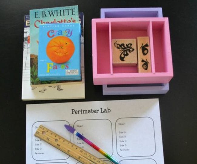 A perimeter lab worksheet with a pencil and ruler laid on top surrounded by materials for the measurement activity