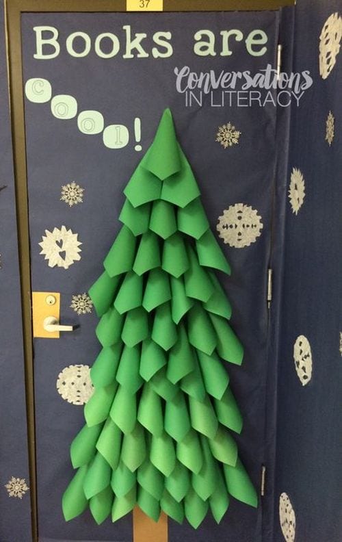 A door is decorated to look like a large Christmas tree.