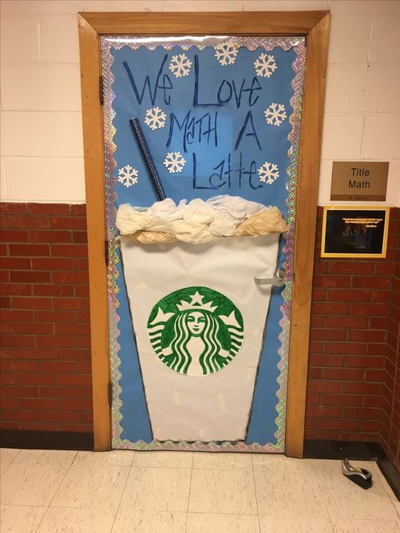 A latte with whip cream is on a classroom door. Text reads We love math a latte.