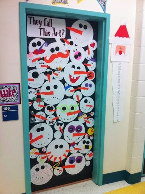 A bunch of snowmen faces cover a door.