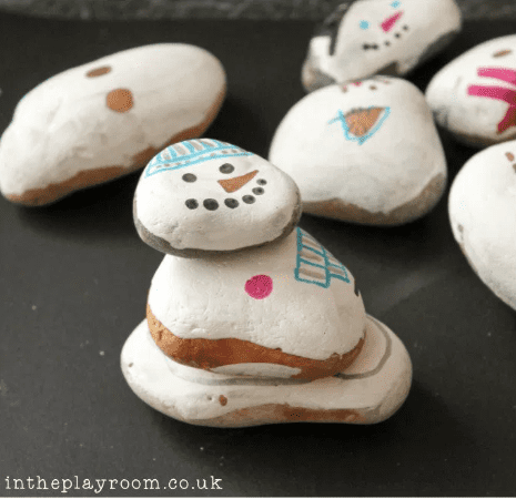 Adorable snowmen made from painted stones as an example of classroom winter crafts