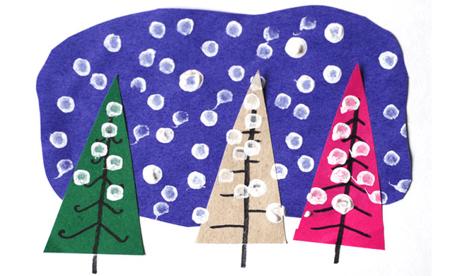 A winterscape made from construction paper and finger paints