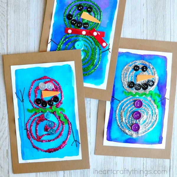 Colorful snowman pictures made from glue swirls on a watercolor backgrounds