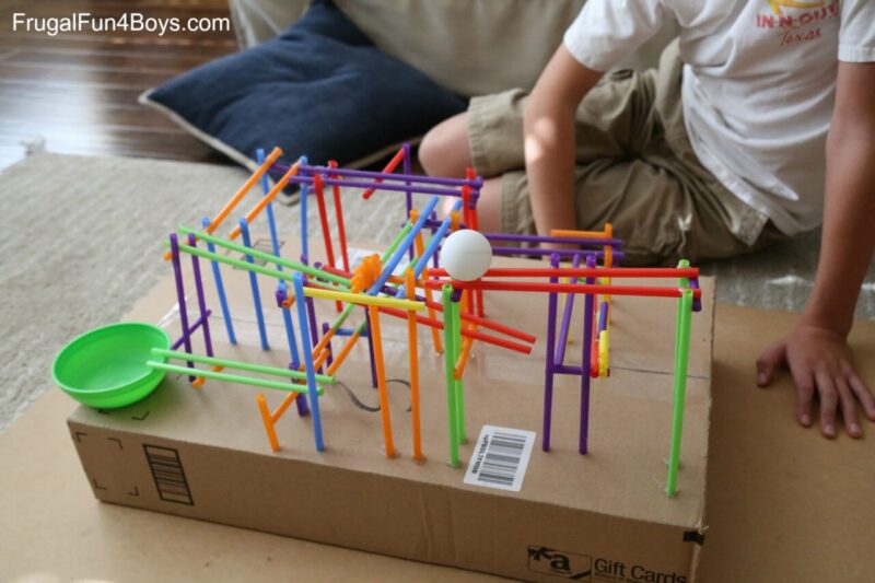 a marble roller coaster made out of straws 