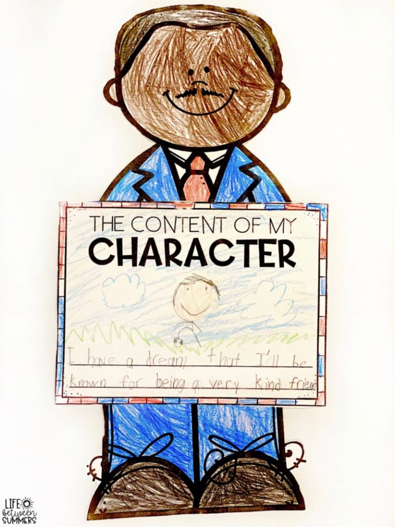 Paper Martin Luther King holding a page with a writing prompts about the content of character