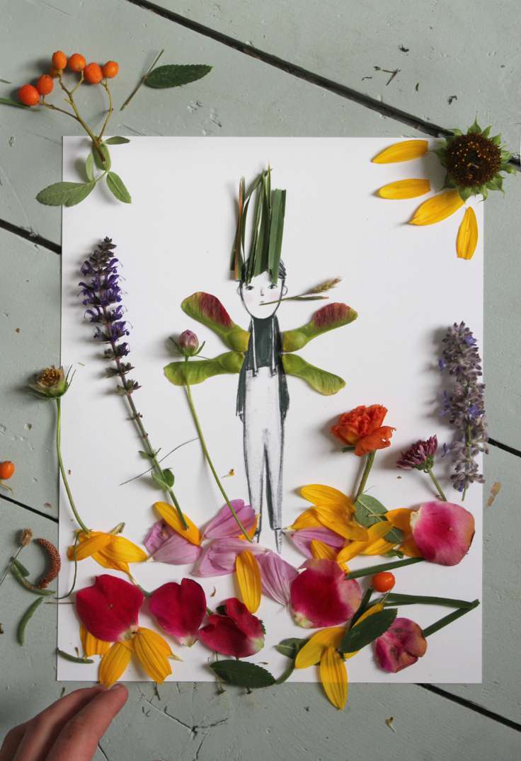 A simple marker drawing of a boy is in the center of the page and leaves and flower petals have been glued around him including to form his arms and hair.