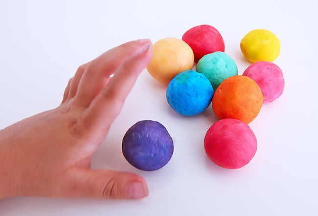 Student playing with homemade colorful bouncy balls