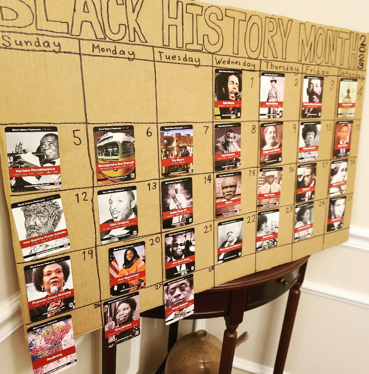 Text Reads Black History Month. It is setup to look like a calendar. There is a card with a different person attached to each day of the month.