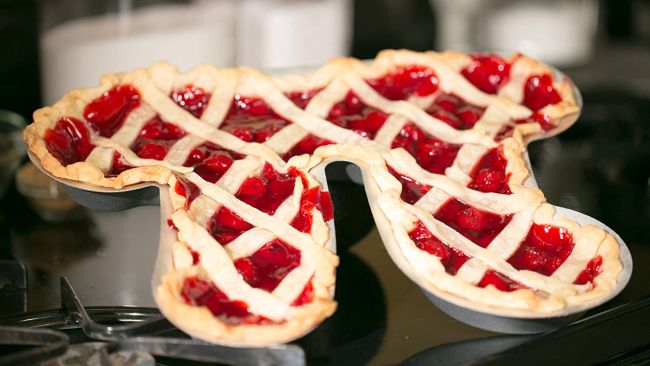 A cherry pie baked in a pi shaped pan