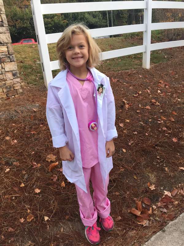 child dressed up as a famous woman doctor for women's history month activity and idea