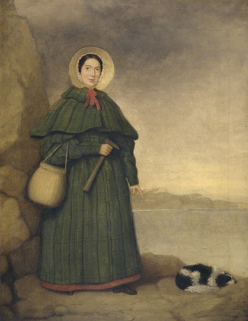 Portrait of Mary Anning with her dog Tray and the Golden Cap outcrop in the background. Natural History Museum, London. This painting was owned by her brother Joseph, and presented to the museum in 1935 by Miss Annette Anning.