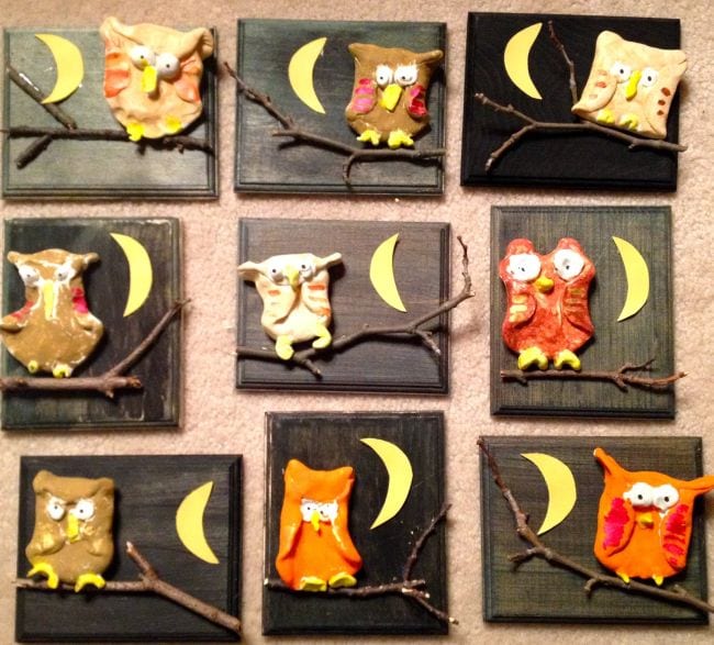 Clay owl artwork mounted on wood plaques