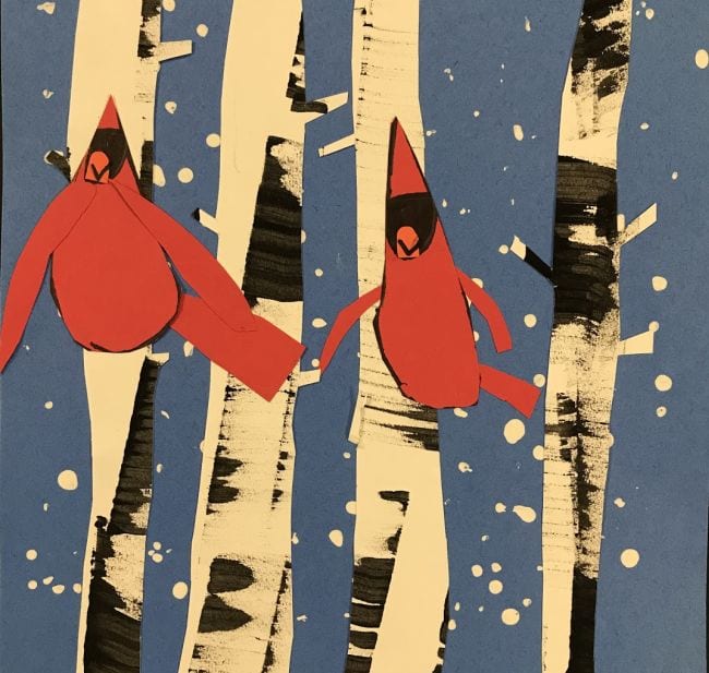 Paper birch trees with cutout cardinals on top