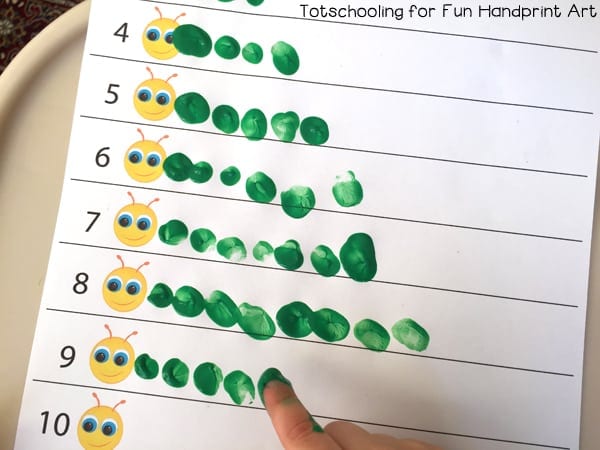 A sheet of paper has a table with rows 1-10. Each row has the corresponding number of fingerprints to each number. They are made to look like caterpillars.