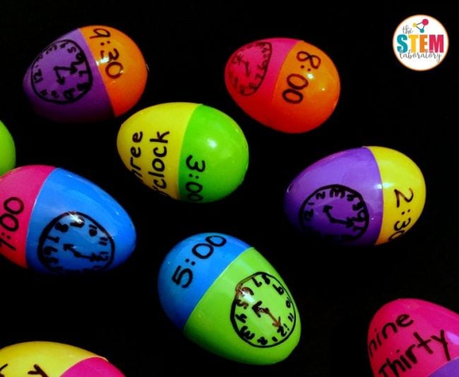 Plastic Easter eggs with analog clocks written on one half and digital and word times written on the other halves