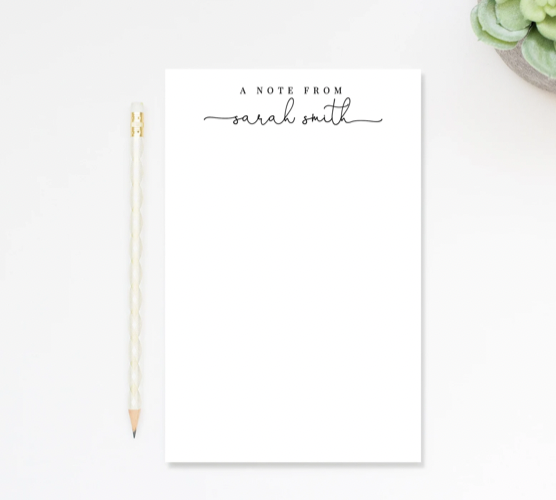 Personalized stationary pad with text at top reading 