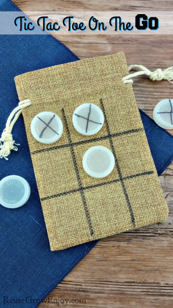 An on the go tic tac toe kit stored in a burlap bag