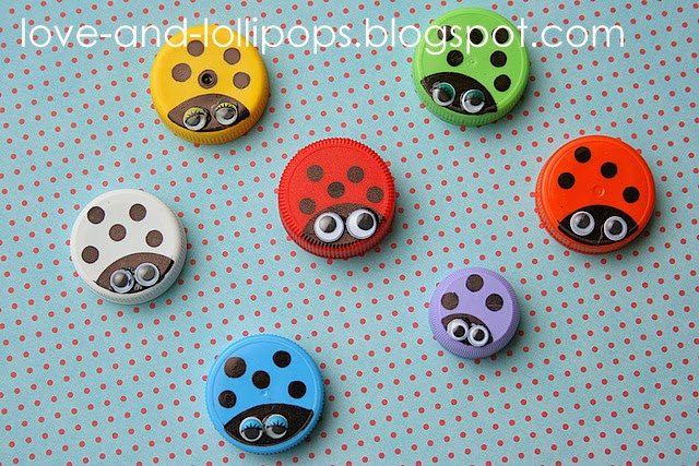 Several bottle caps painted different colors with black dots on them to look like lady bugs. They also have googly eyes.
