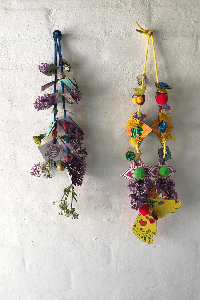 Two necklaces are made from found objects.