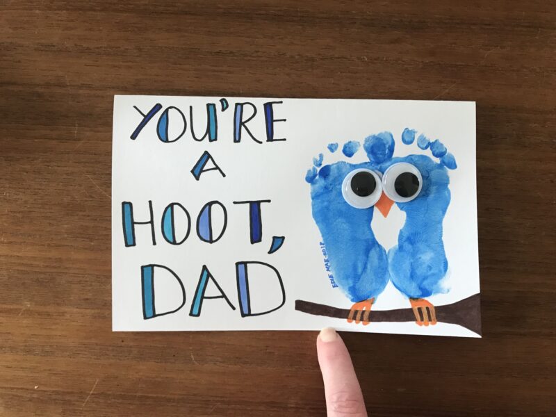 Two blue footprints are pieced together with googly eyes to look like an owl. Text reads You're a Hoot Dad.