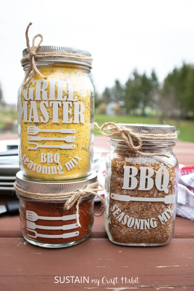 Three jars are shown filled with different seasonings in this example of Father's Day crafts for kids.