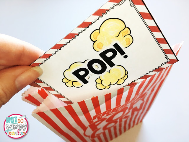 A hand pulling a car with an illustration of popcorn and the word pop! out of a red and white striped bag as an example of vocabulary activities