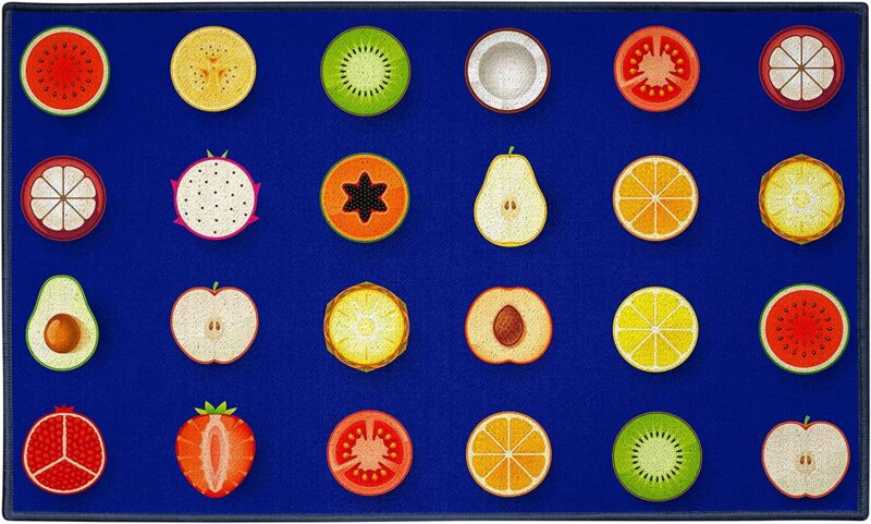 A blue rug has different fruit slices making up the 23 seats in this example of classroom rugs.