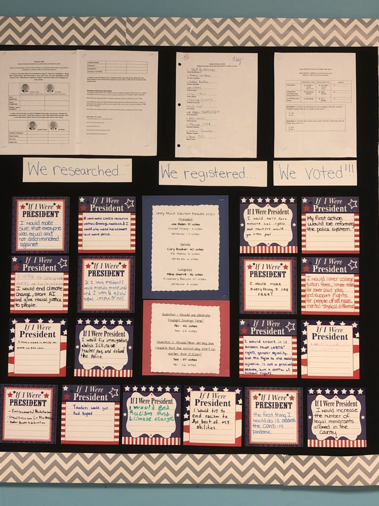 A bulletin board says We researched, we registered, we voted. It has a lot of papers, etc. attached.
