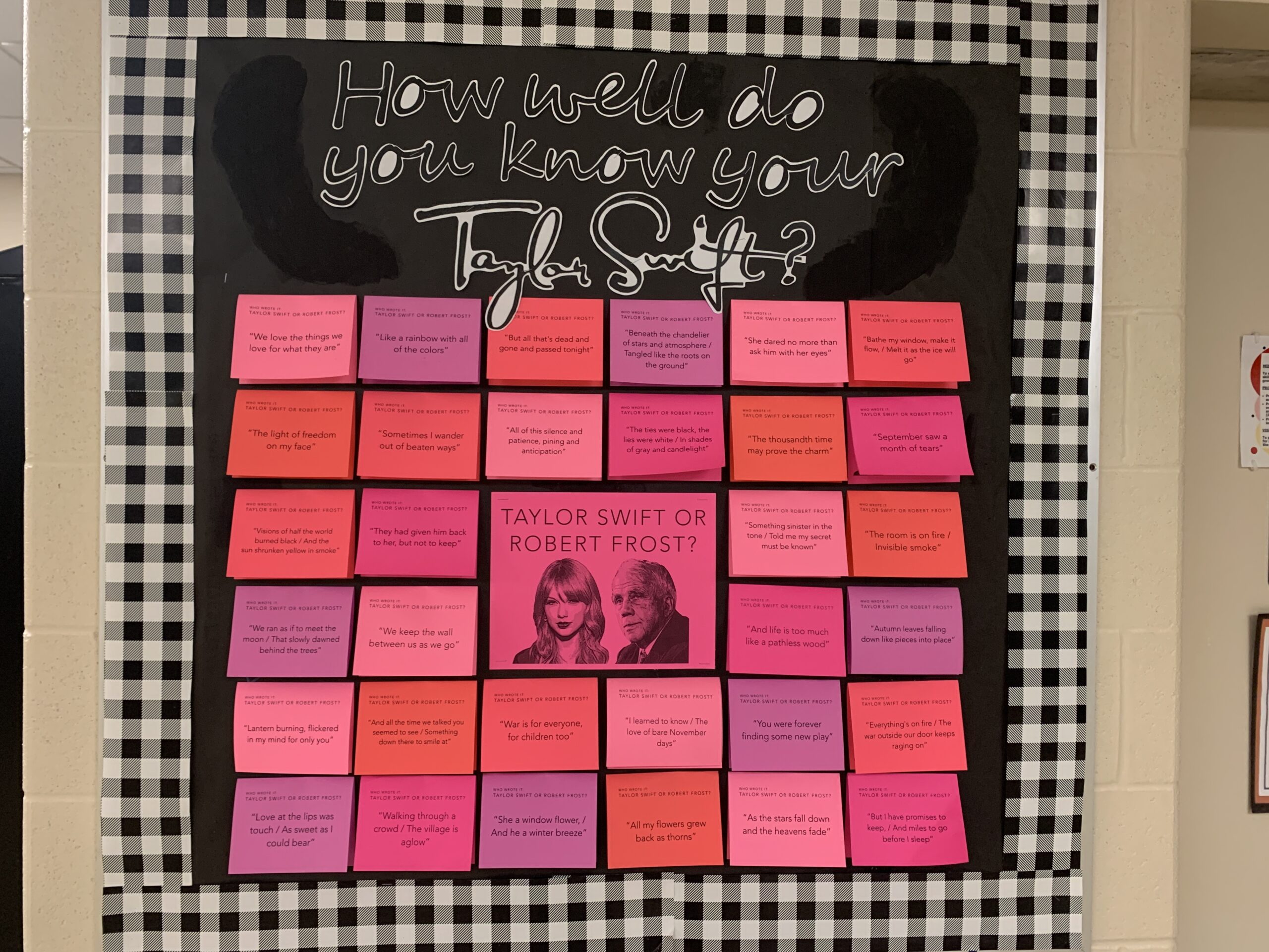 A Bulletin Board asks who said it Taylor Swift or Robert Frost. It then has post its to lift with quotes on them.