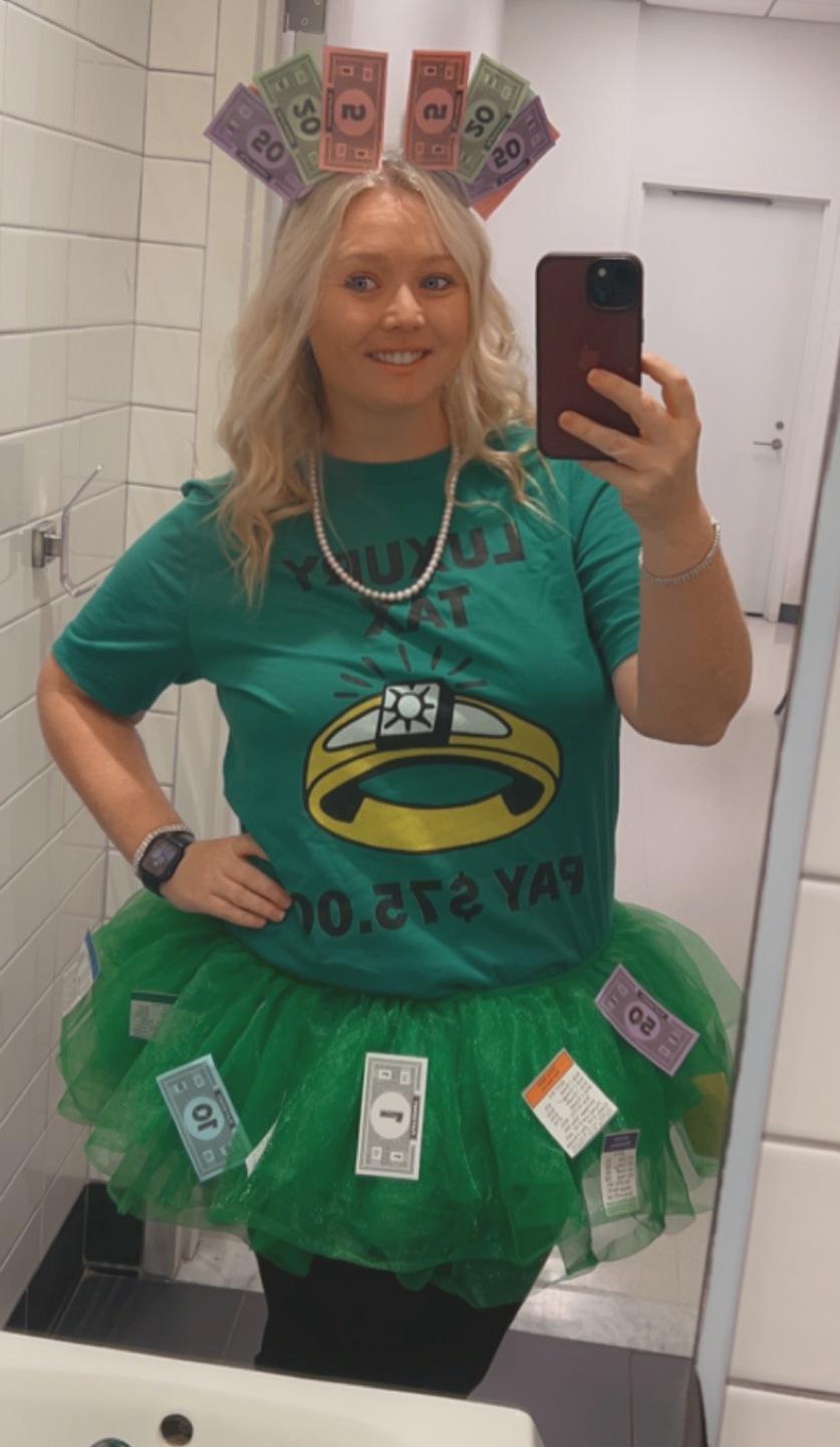 Teacher dressed to represent the Luxury Tax card from a Monopoly game